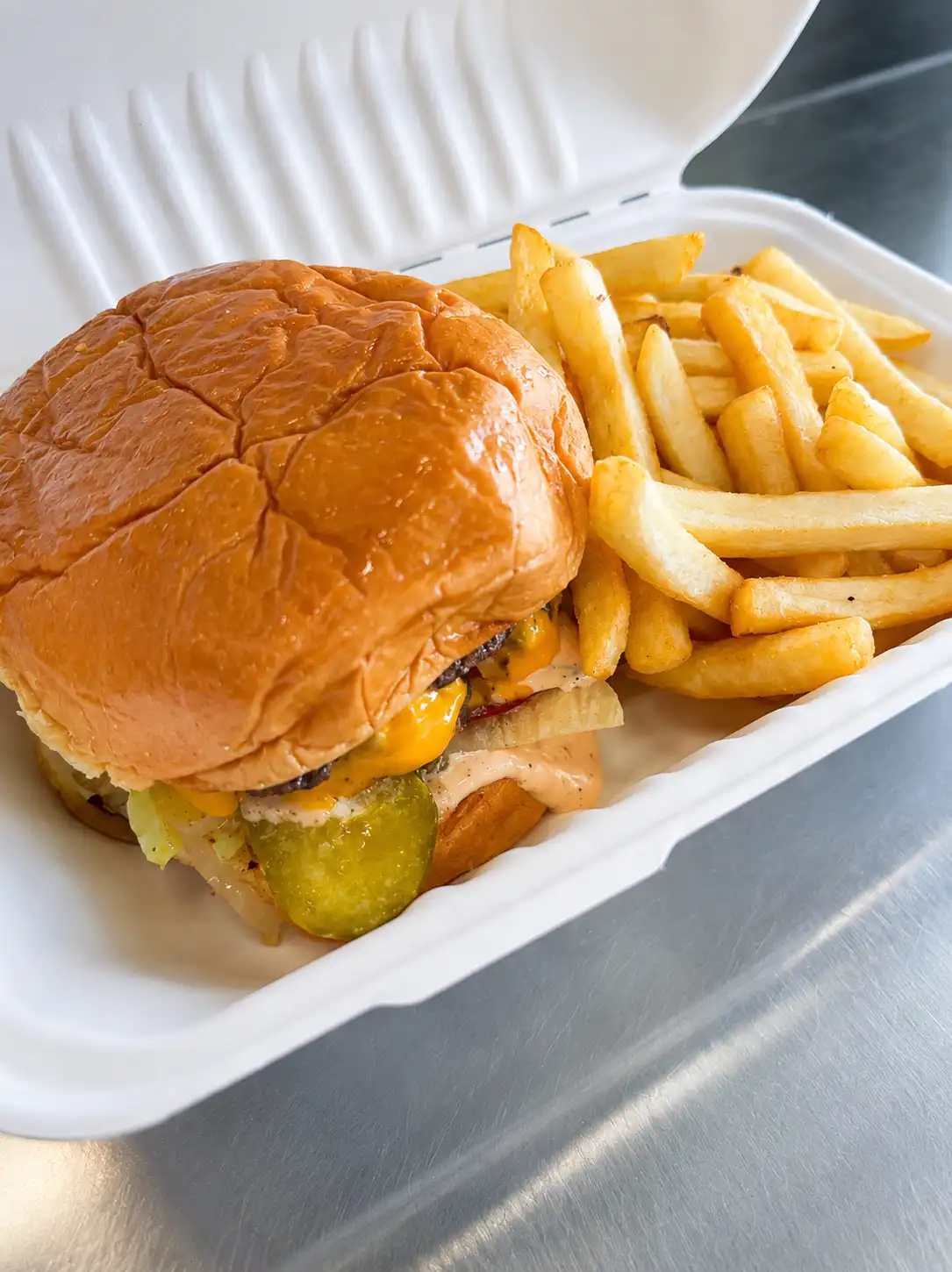 Burger and fries on tray