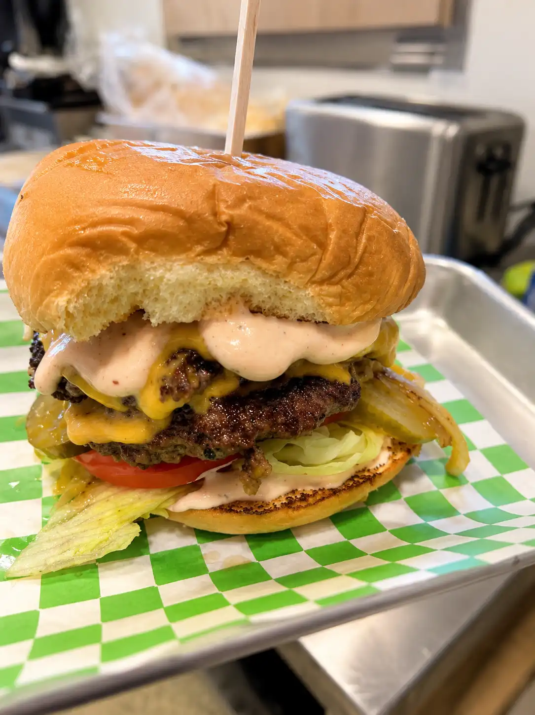 Cheeseburger on green tray
